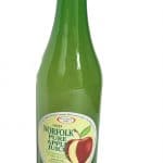 A Green glass bottle of apple juice.